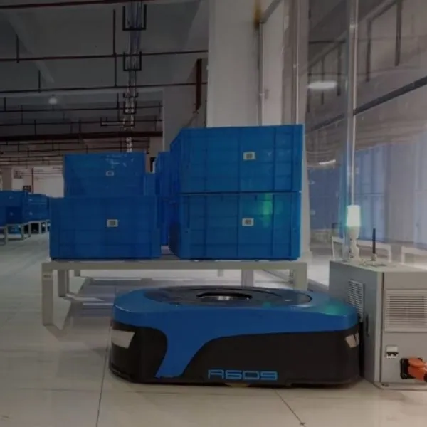 Autonomous mobile robots transporting materials through a warehouse