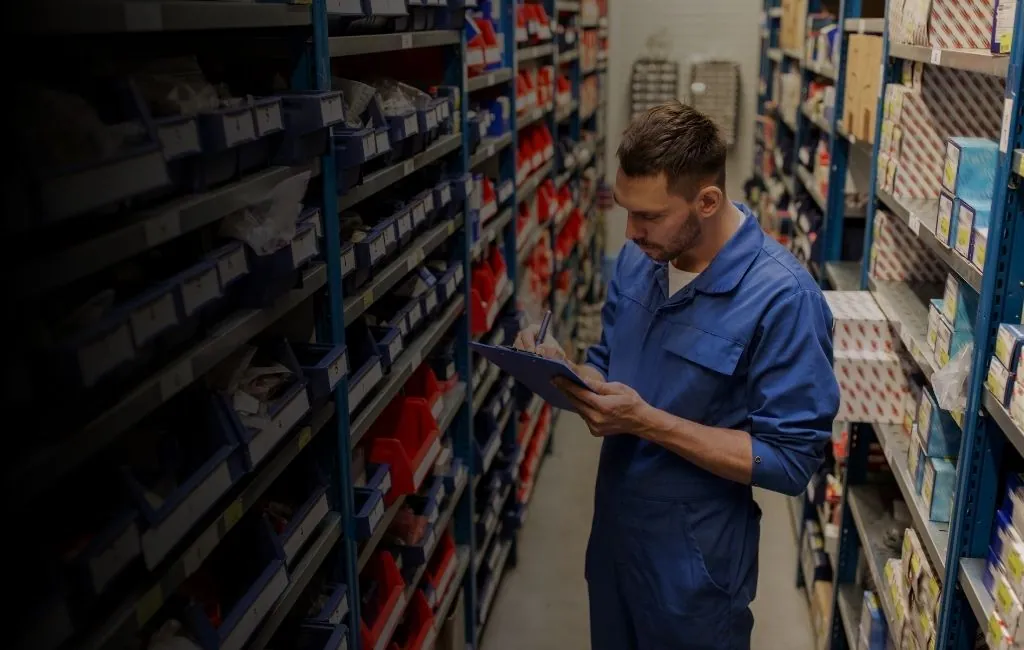 Automotive parts moving through an automated line-side delivery system on an assembly floor