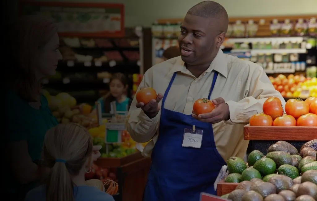 Grocery distribution center with fresh produce and stocked warehouse shelving